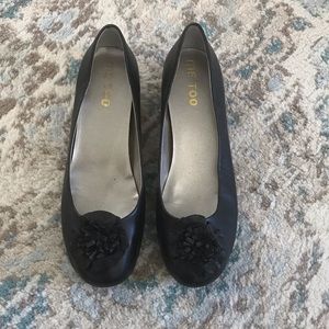 Black flats with flower accent